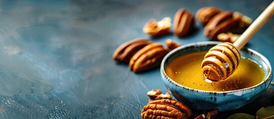 Poster - Blue Rosh Hashanah background with honey dish and pecan walnuts ideal for copy space image