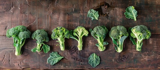 Aufkleber - Broccoli arranged on a wooden surface in a flat lay composition with copy space image