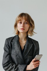 Poster - Confident businesswoman holding smartphone