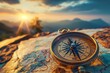 © Sariyono - Vintage compass on map with mountain sunset in background