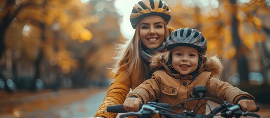 Wall Mural - Smiling Mother and Child Riding Bikes in Autumn