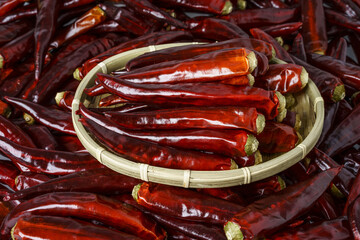 Poster - Close-up of a bamboo basket with stacked dried red peppers on many others, South Korea
