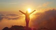 © grigoryepremyan - Silhouette of happy woman open arms in sunrise at mountain top