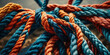 © AC - Close-up of colorful intertwined ropes with intricate textures and vibrant colors
