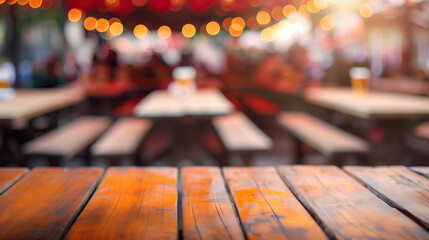 close up of empty wooden table with blurred bavarian oktoberfest on open air background