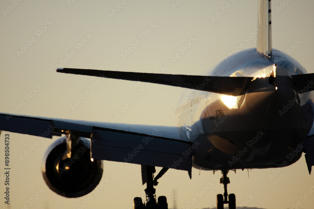B777 Rear View Osaka, Japan - July 3, 2024: Rear view of a Boeing 777-281 aircraft at ...