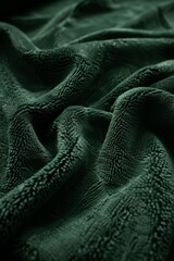 Poster - Abstract background wallpaper. Dark green fabric, with texture and softness against an isolated background. Folds in the fabric or subtle wrinkles to emphasize its quality material.