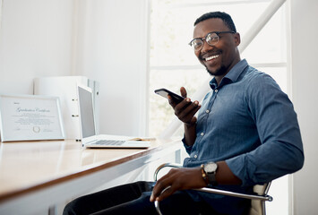 Canvas Print - Portrait, office and man with cellphone, glasses and communication with contact, laptop and online. Vision, editor and person with mobile, voice note and project of ebook, social media and creative