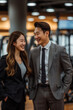 © S photographer - Asian woman and man in suits talking in exercise gym.