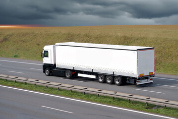 Wall Mural - Logistics Freight Cargo Truck on Intercity Highway