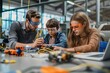 © Asad - Elementary school girls get hands-on experience in science as a male teacher helps them construct a robotic car in their after-school robotics club