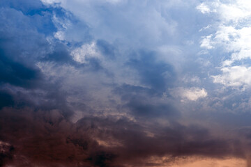 Wall Mural - dramatic sky with clouds at sunset or sunrise