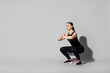 © New Africa - Young woman doing aerobic exercise on light grey background. Space for text