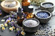 © Peeradontax - A collection of aromatherapy essentials featuring dried lavender buds in ceramic bowls and amber dropper bottles.
