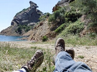 feet with hiking boots on the french coast