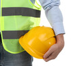 © New Africa - Engineer with hard hat on white background, closeup