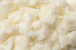 © New Africa - Natural shea butter as background, top view