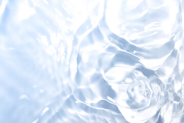 Wall Mural - the clear blue surface of the water gradients from light to dark.