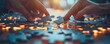 © EmPics - Business group with puzzle pieces fitting together, business strategy, collaborative problem solving
