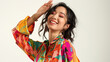 © ZAmri - stylish asian woman with bright colored gbtl top shirt, lifting her hand, smiling, portrait, white background, dynamic angle