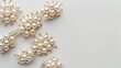 © Emin - White background with top view of stylish pearl hair clip set for trendy beauty accessories Plenty of space for text