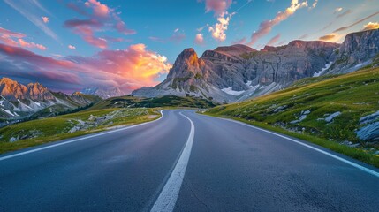 Poster - Aerial view of a winding road surrounded by mountains, great for travel or adventure concept