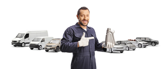 Poster - Car mechanic with vans and cars holding engine oil bottle and pointing