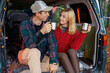 © Andrii  - Travel Van Adventure: Couple Drinking Tea