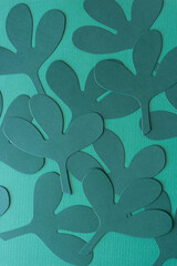 Canvas Print - overlapping stylized paper leaves die-cut from dark green paper on blank green paper