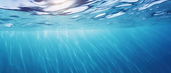 Wall Mural - Water surface with air bubbles. Water texture. Water Drops. Water splash with bubbles on blue background. Copy space for text. Water wave and air bubbles in blue water background. Copy space.