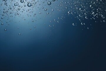 Water surface with air bubbles. Water texture. Water Drops. Water splash with bubbles on blue background. Copy space for text. Water wave and air bubbles in blue water background. Copy space.