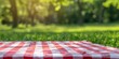 © gen_pick - Checkered Cloth on Lush Green Grass, Perfect Picnic Spot