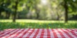 © gen_pick - Checkered Cloth on Lush Green Grass, Perfect Picnic Spot