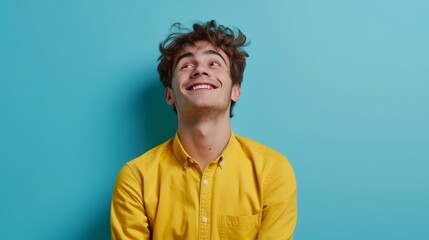 Photo of corporate cheerful positive ceo in yellow shirt smiling toothily dreaming thoughtful looking away relaxing after hard-working day.