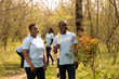 © DC Studio - Portrait of african american couple preserve natural ecosystem by planting trees, cultivating consciousness through community service. Volunteers digging holes with a shovel, save the planet.