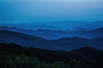 Aufkleber - A view of a mountain range at sunset with the sky ablaze in warm colors