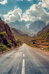 Poster - A serene mountain road with a vast landscape of mountains in the background, ideal for outdoor and adventure scenes