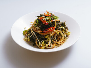 Poster - Close-up of seasoned seaweed(hizikia fusiforme) with bean sprouts and red peppers on dish, South Korea
