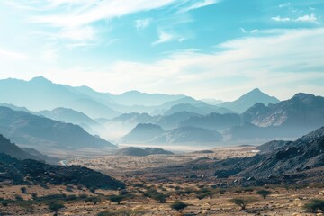 Poster - A distant view of a mountain range with peaks and valleys visible