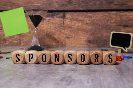 concept word on cube on wooden desk - Sponsors