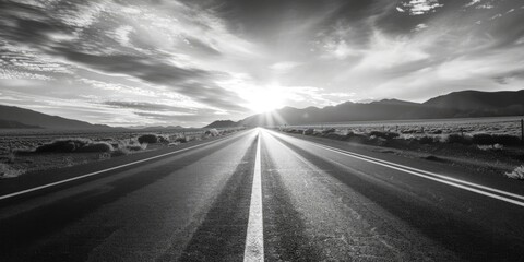 Poster - Black and white image of a deserted road in the desert, suitable for use as a background or in travel articles