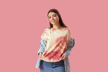 Wall Mural - Stylish young woman in tie-dye t-shirt on pink background