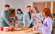 © Pixel-Shot - Group of young friends with beer and pizza at home party