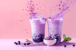 © SASI   SPACE - Blueberry Purple Pink Taro milk tea with purple milk and tea powder splashing in background, Purple taro bubble tea, cold and refreshing drink with purple taro tapioca pearls and ice for advertisement