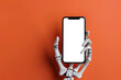 © Lux Images - Skeleton hand holding smartphone with blank screen copy space for Halloween advertisement on orange background