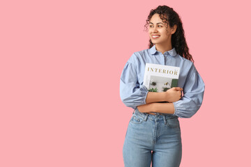 Wall Mural - Beautiful young African-American woman in stylish blue collar shirt with magazine on pink background