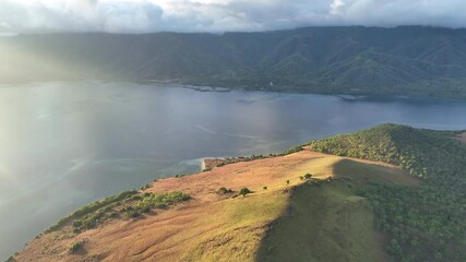 Poster - Morning sunlight illuminates the scenic island of Lembata, Indonesia. This beautiful and biodiverse area is part of the famed Ring of Fire and is home to high marine biodiversity.