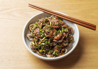 Sticker - Close-up of seasoned cockles with seasonings on white dish with wood chopsticks, South Korea
