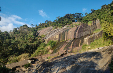 Mountain stone rock waterfall dry fall water blade cliff hill nature forest green park island beautiful trees bush animal blue sky sun life day vacation landscape trail path climb