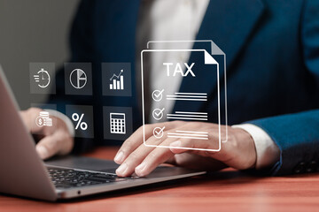 E-tax, Taxpayer using laptop filling out tax forms online for tax payment. State taxes, data analysis, paperwork, financial research, report VAT and property tax of business.